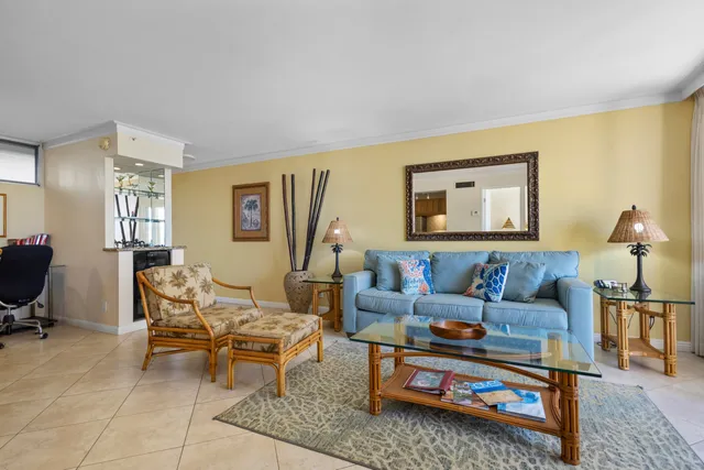 a living room with furniture wooden floor and a window