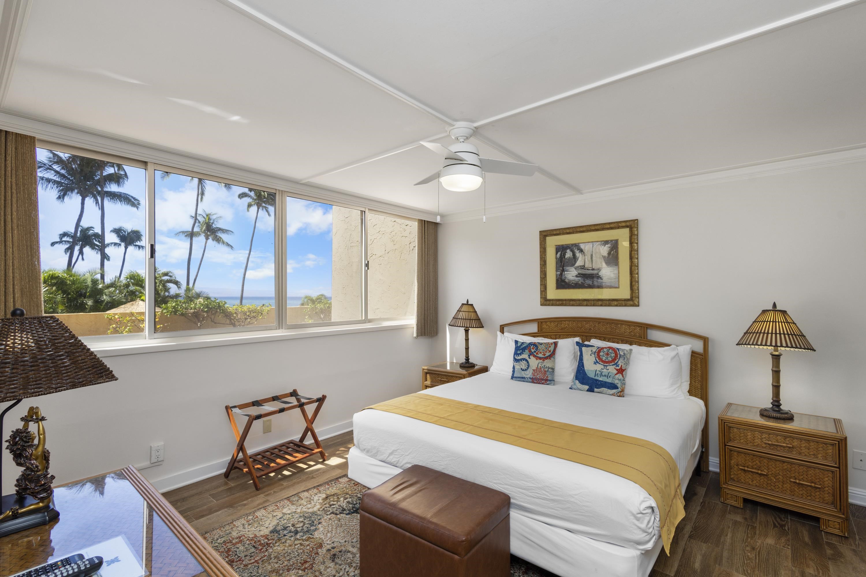 4365 Lower Honoapiilani Road, Unit 115 Lahaina, HI 96761 - Photo 16 of 44 a bedroom with a large bed and a window