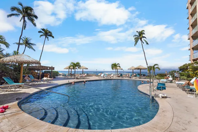 a view of a swimming pool with a patio