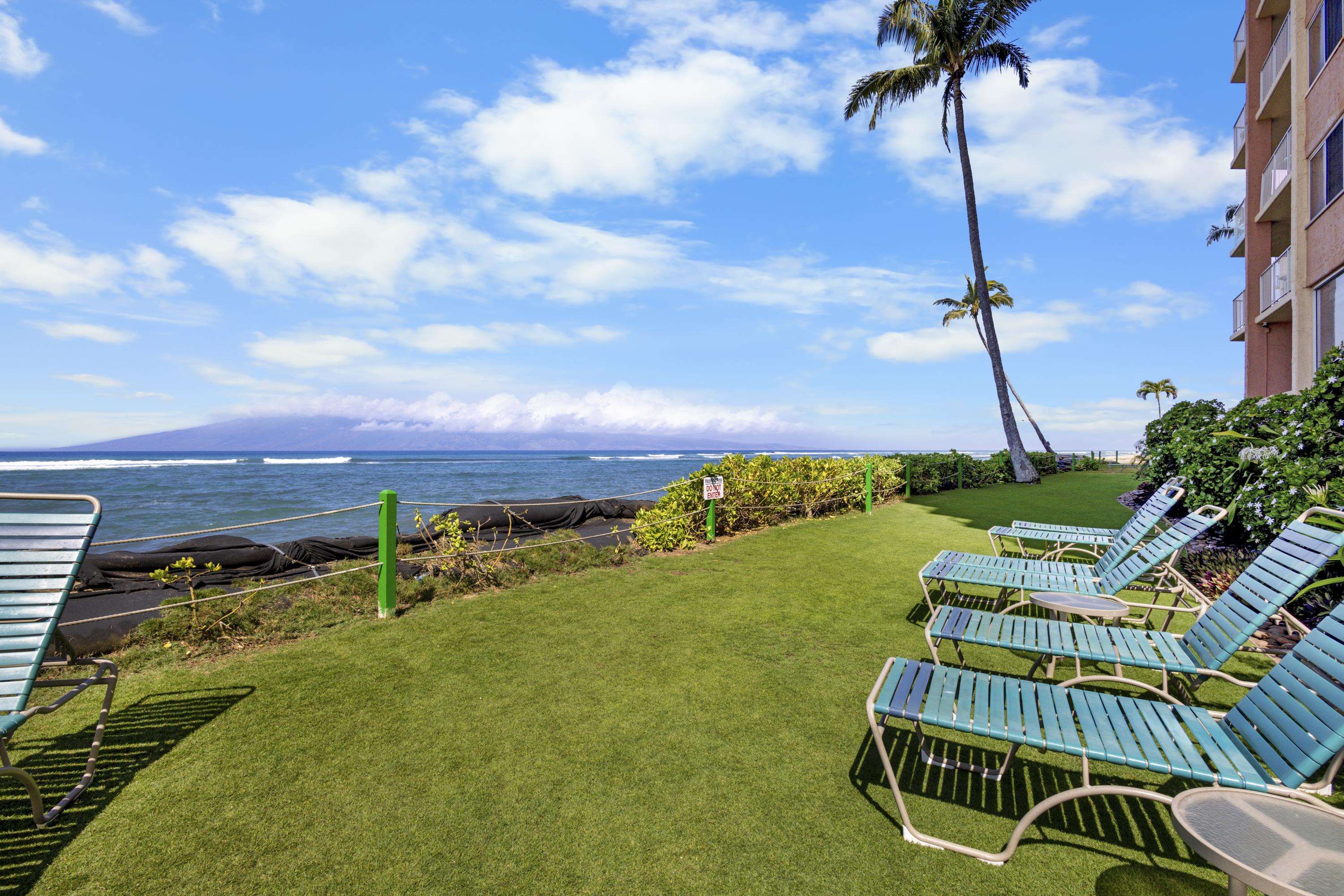 4365 Lower Honoapiilani Road, Unit 115 Lahaina, HI 96761 - Photo 32 of 44 a view of a swimming pool with a garden