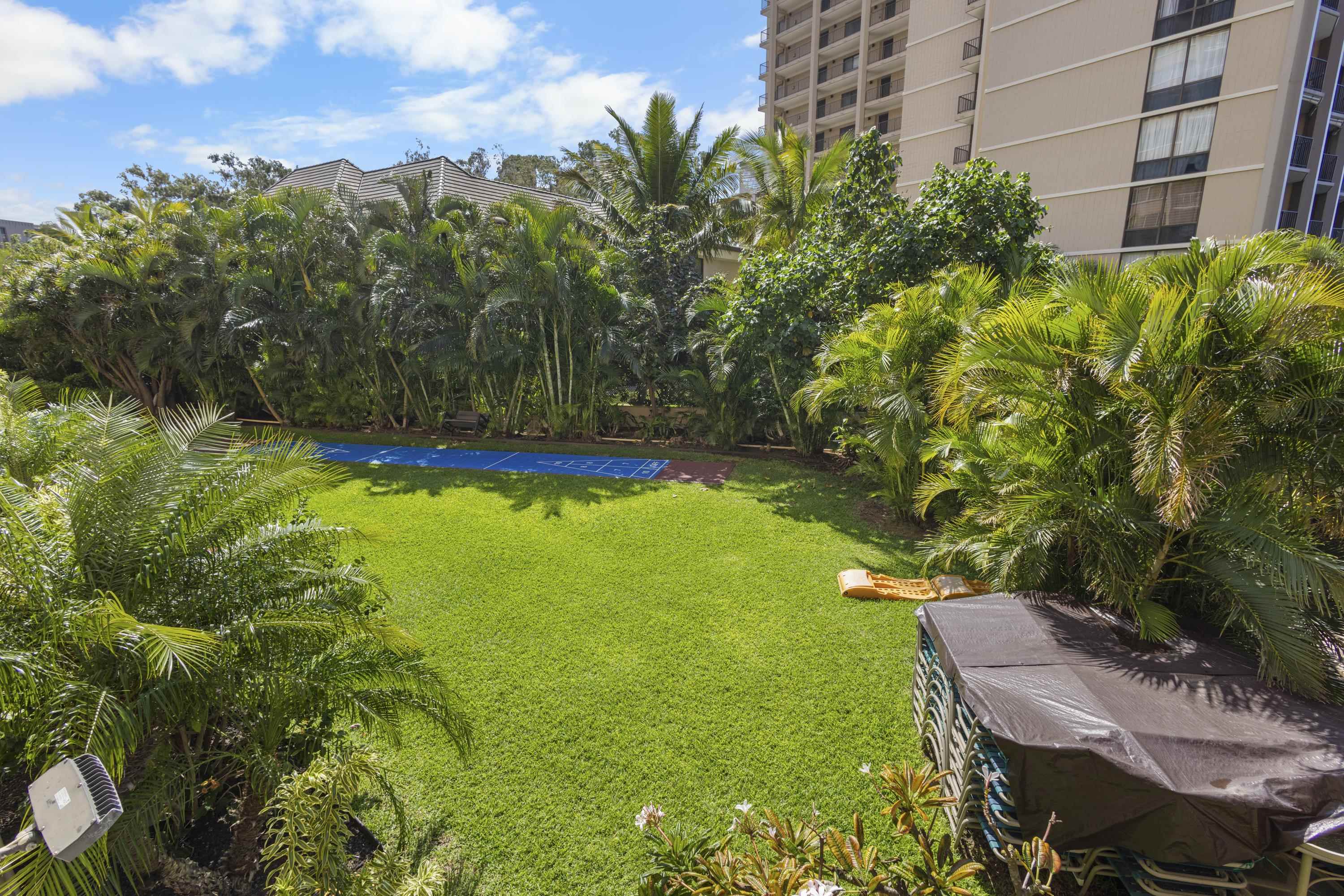 4365 Lower Honoapiilani Road, Unit 115 Lahaina, HI 96761 - Photo 36 of 44 a view of yard with swimming pool and green space