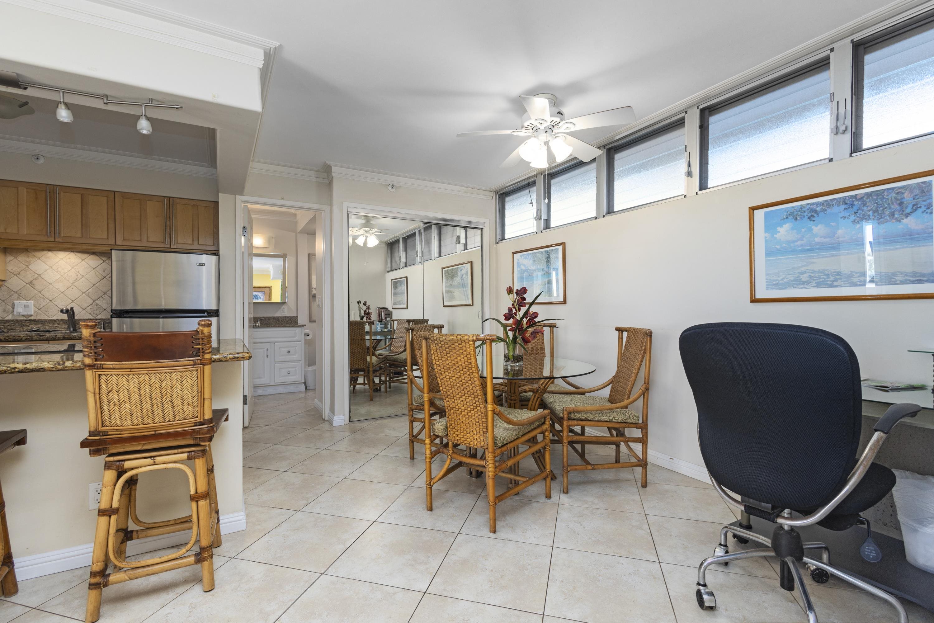 4365 Lower Honoapiilani Road, Unit 115 Lahaina, HI 96761 - Photo 6 of 44 a view of a dining room with furniture