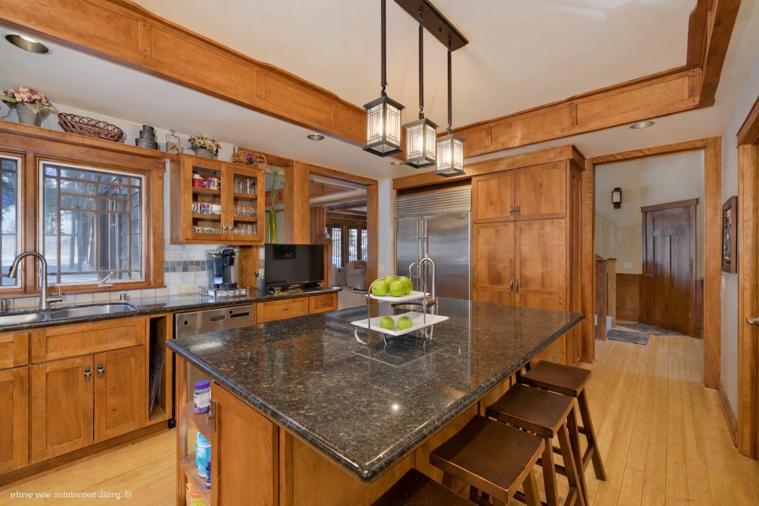 56 Wagon Road Mammoth Lakes, CA 93546 - Photo 9 of 48 a kitchen with a table chairs and refrigerator