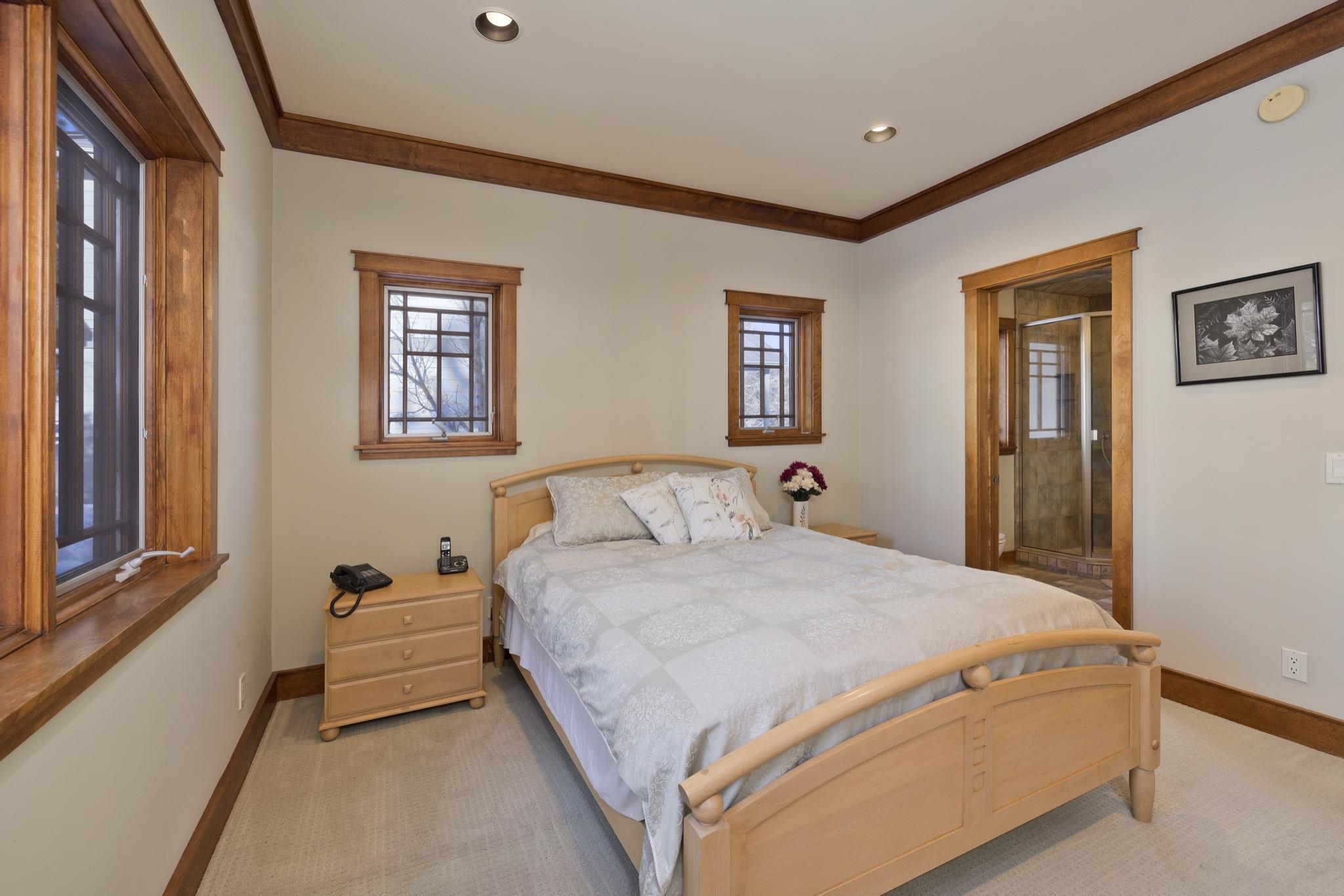 56 Wagon Road Mammoth Lakes, CA 93546 - Photo 19 of 56 Bedroom with light carpet, crown molding, multiple windows, and recessed lighting