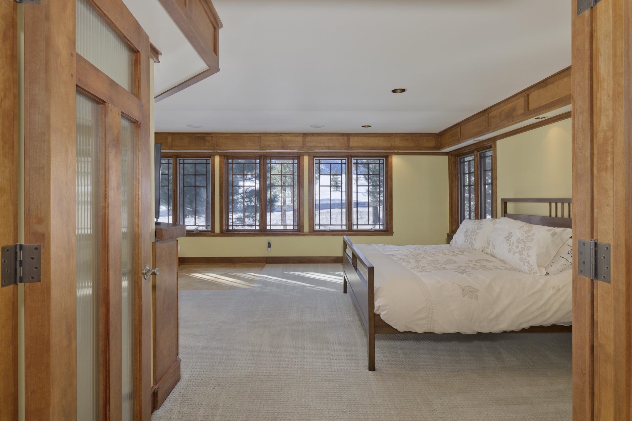 56 Wagon Road Mammoth Lakes, CA 93546 - Photo 24 of 56 Large sunny Primary Bedroom with sitting/exercise space and balcony