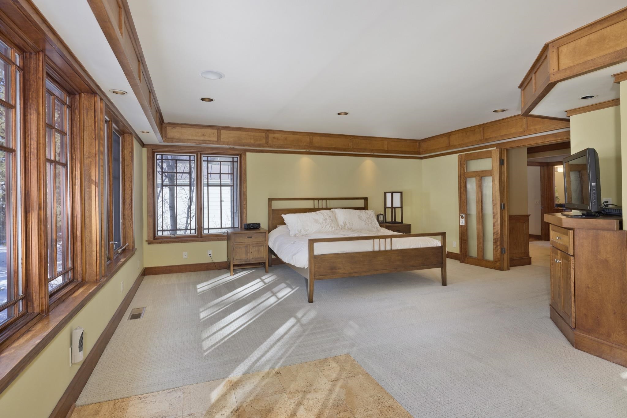 56 Wagon Road Mammoth Lakes, CA 93546 - Photo 21 of 48 a spacious bedroom with a bed and glass door