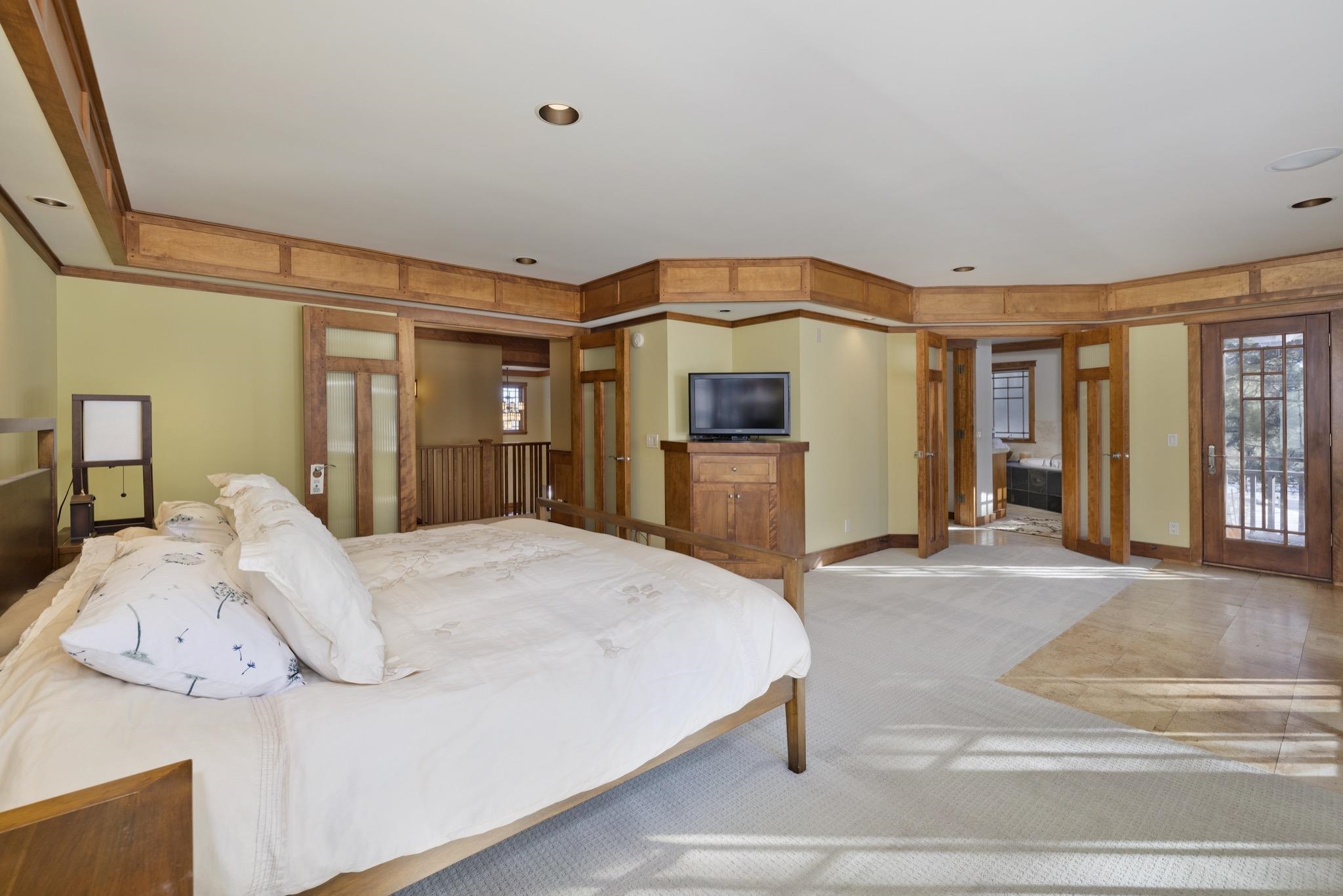 56 Wagon Road Mammoth Lakes, CA 93546 - Photo 22 of 48 a spacious bedroom with a bed and a large window