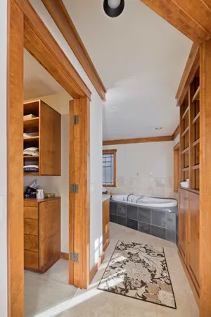 a bathroom with a granite countertop sink a toilet and bathtub