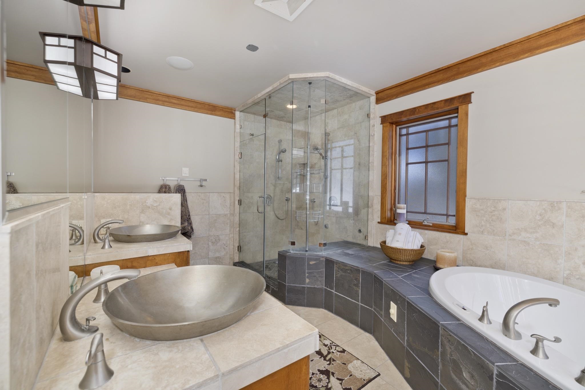 56 Wagon Road Mammoth Lakes, CA 93546 - Photo 26 of 48 a bathroom with a granite countertop sink a toilet and bathtub