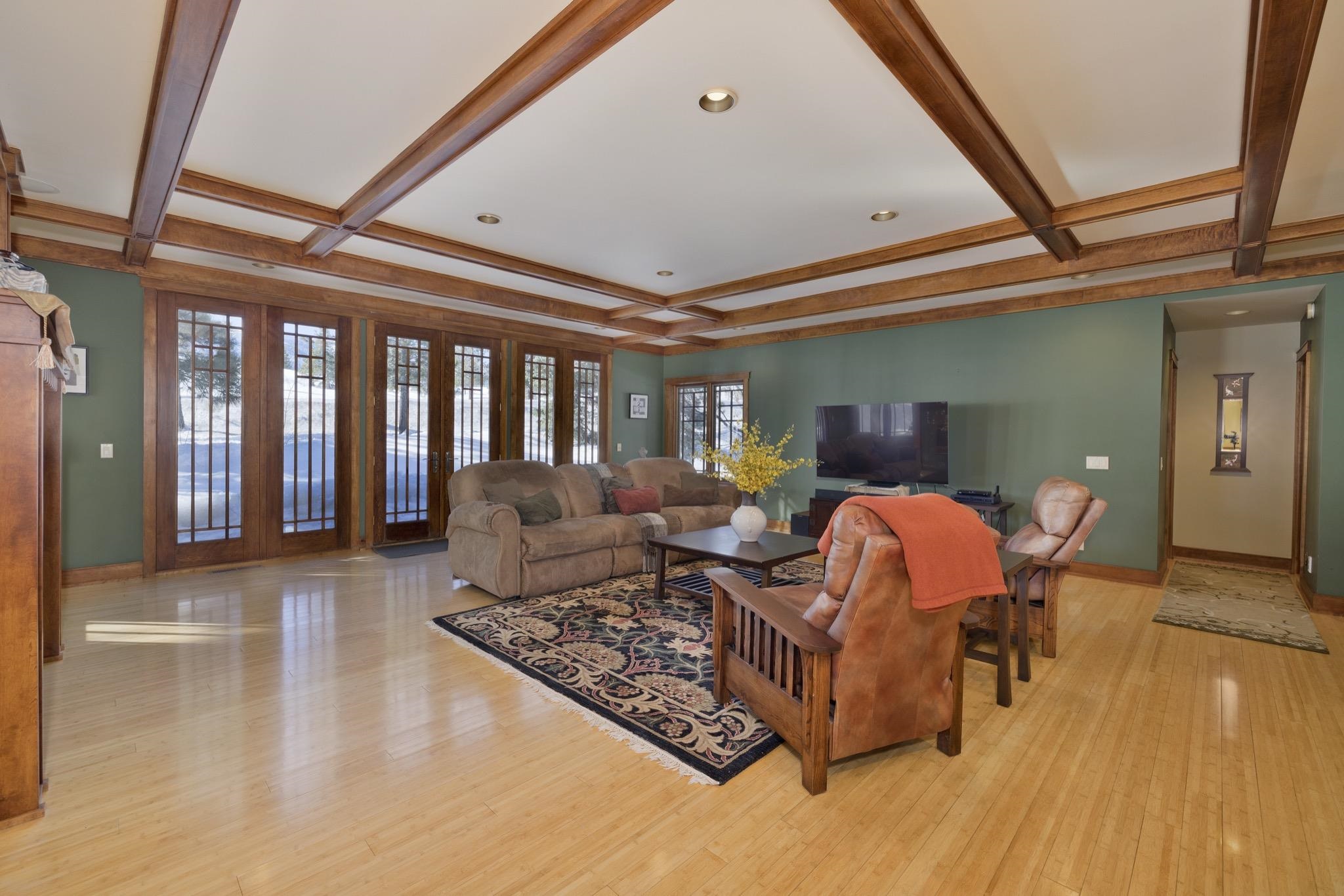 56 Wagon Road Mammoth Lakes, CA 93546 - Photo 41 of 56 Living area featuring beamed ceiling, light wood finished floors, coffered ceiling, and recessed lighting