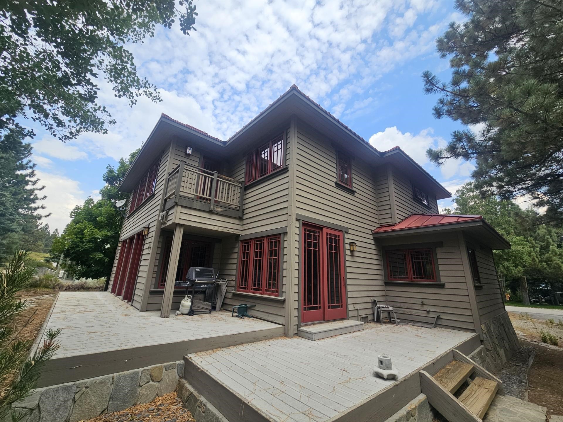 56 Wagon Road Mammoth Lakes, CA 93546 - Photo 46 of 56 Rear view of property with a metal roof, a wooden deck, and a balcony