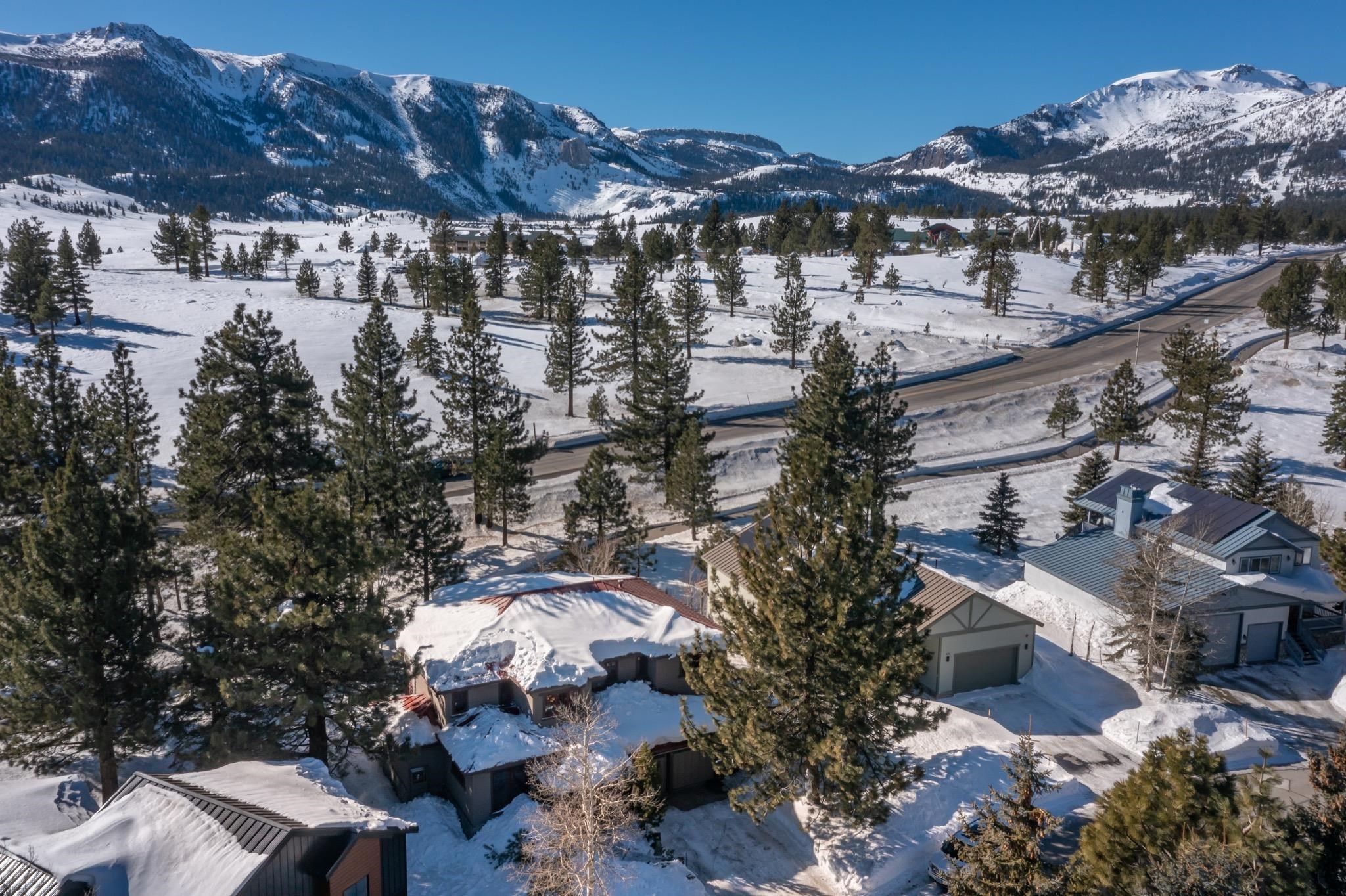 56 Wagon Road Mammoth Lakes, CA 93546 - Photo 51 of 56 Snowy aerial view featuring a mountain view