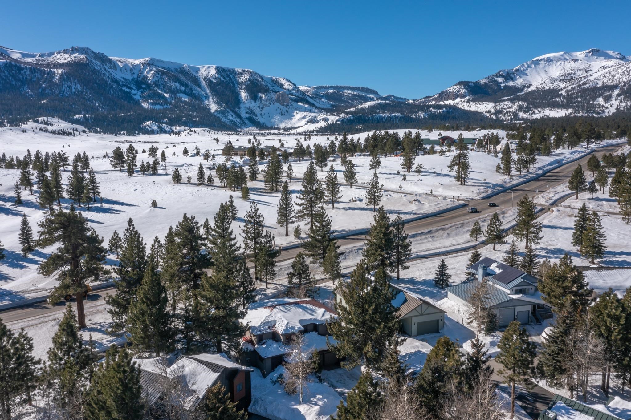 56 Wagon Road Mammoth Lakes, CA 93546 - Photo 54 of 56 Snowy aerial view featuring a mountain view