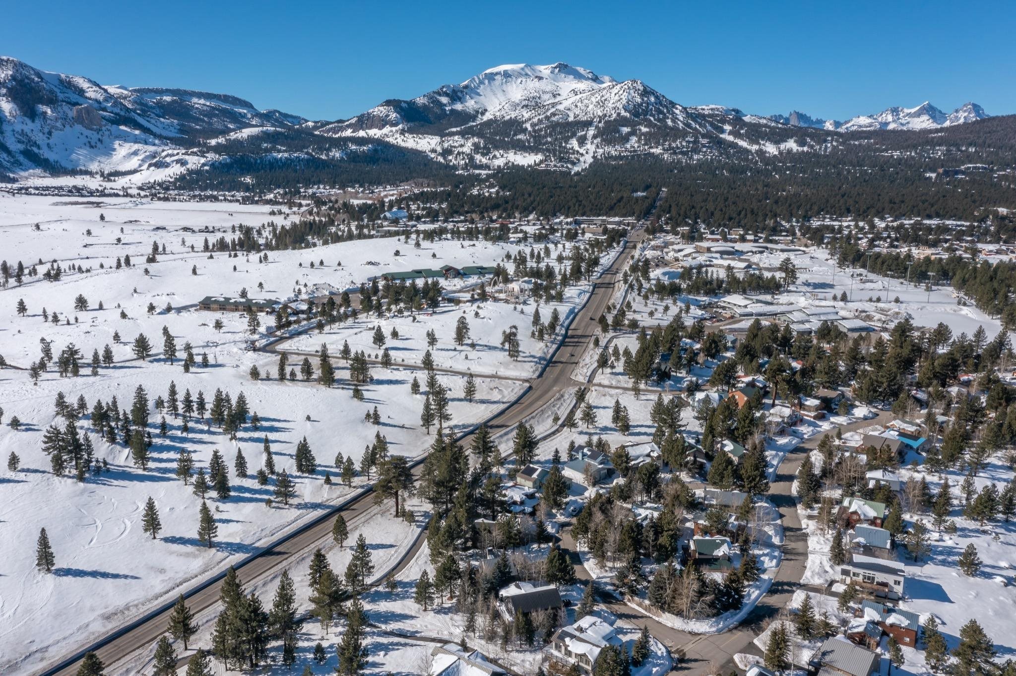 56 Wagon Road Mammoth Lakes, CA 93546 - Photo 55 of 56 Snowy aerial view featuring a mountain view