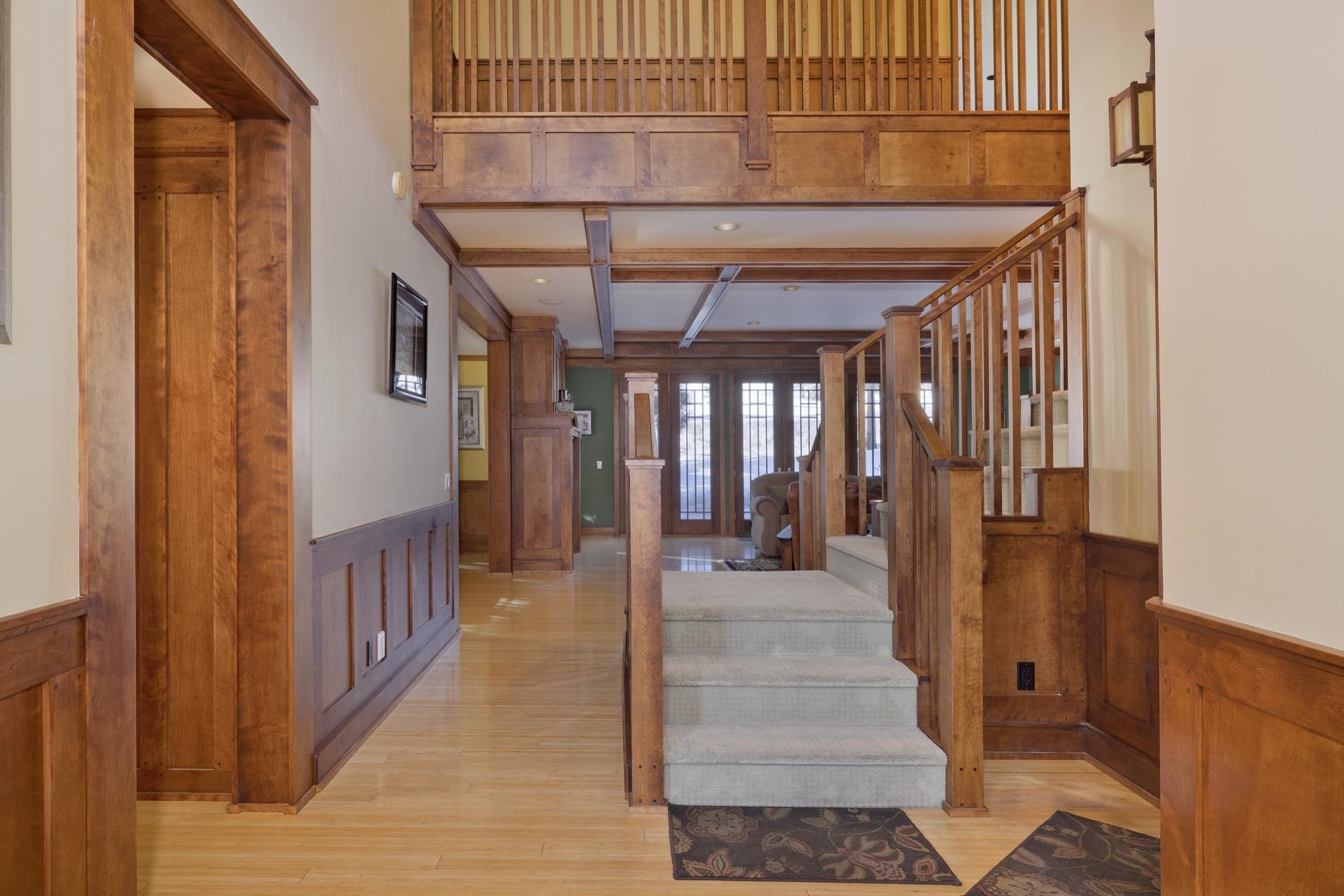 56 Wagon Road Mammoth Lakes, CA 93546 - Photo 7 of 56 Stairs with a wainscoted wall, beam ceiling, coffered ceiling, wood finished floors, and recessed lighting
