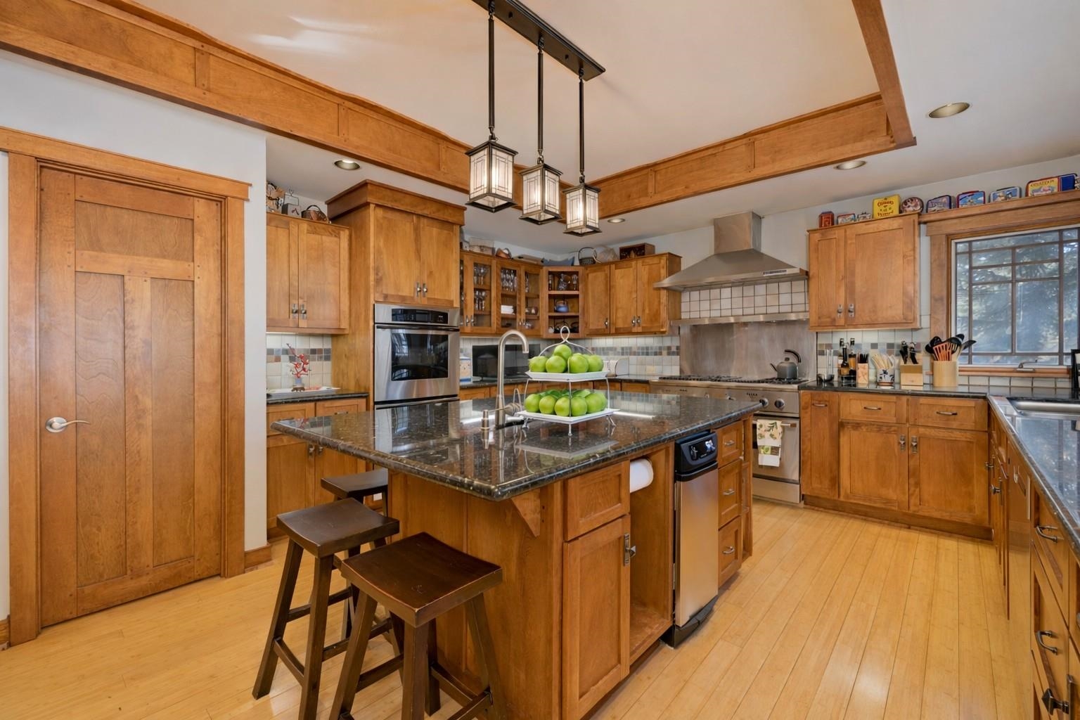 56 Wagon Road Mammoth Lakes, CA 93546 - Photo 7 of 48 a kitchen with stainless steel appliances granite countertop a sink and cabinets