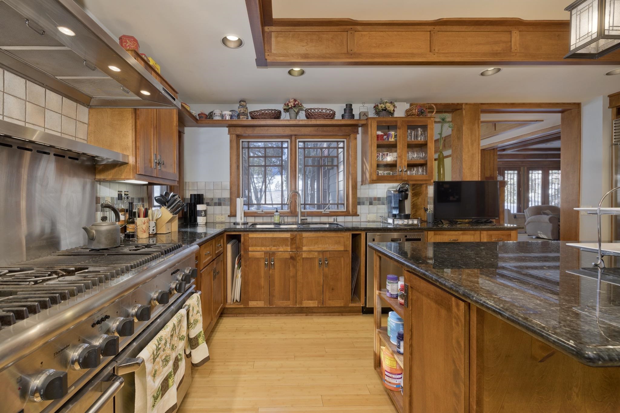 56 Wagon Road Mammoth Lakes, CA 93546 - Photo 8 of 48 a kitchen with stainless steel appliances granite countertop a sink stove and cabinets