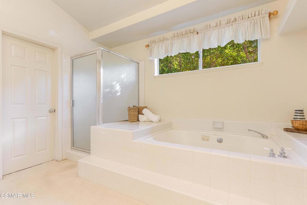 368 Pellburne Court Simi Valley, CA 93065 - Photo 31 of 55 a bathroom with a bathtub and a shower