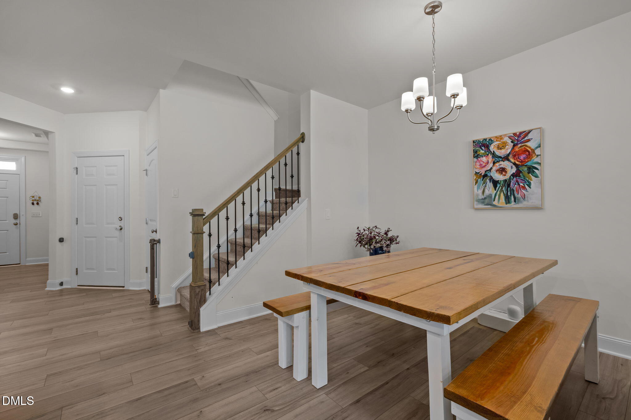 1031 Culloden Circle Durham, NC 27713 - Photo 15 of 50 a view of a room with wooden floor and chandelier