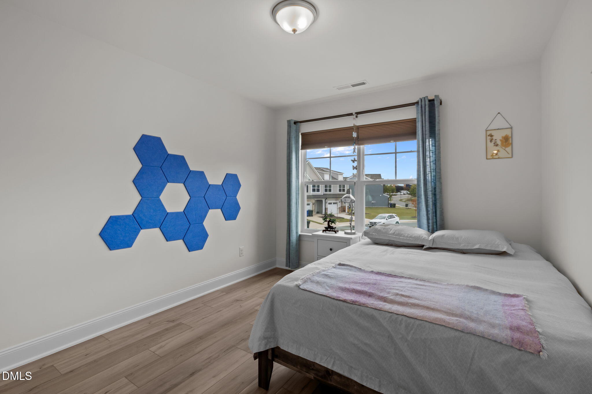 1031 Culloden Circle Durham, NC 27713 - Photo 23 of 50 a bedroom with a bed and a window