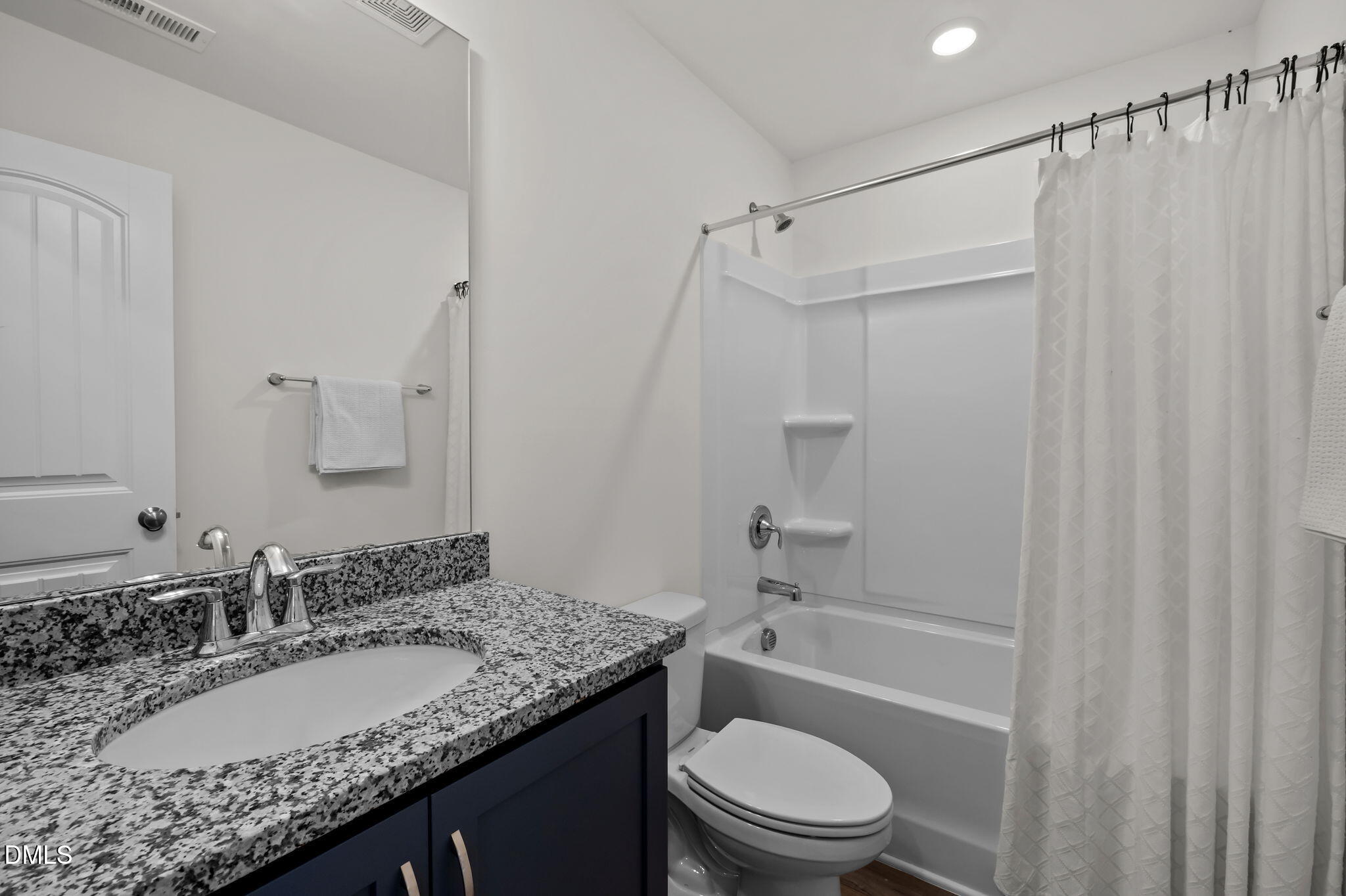 1031 Culloden Circle Durham, NC 27713 - Photo 25 of 50 a bathroom with a granite countertop sink toilet and shower