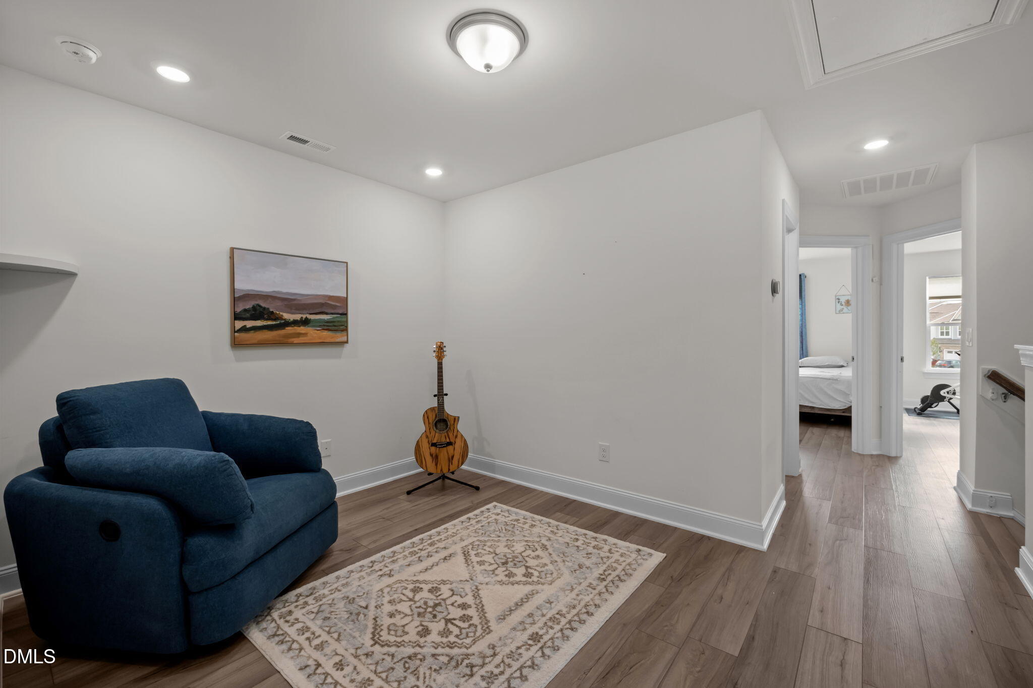 1031 Culloden Circle Durham, NC 27713 - Photo 26 of 50 a living room with furniture and a rug