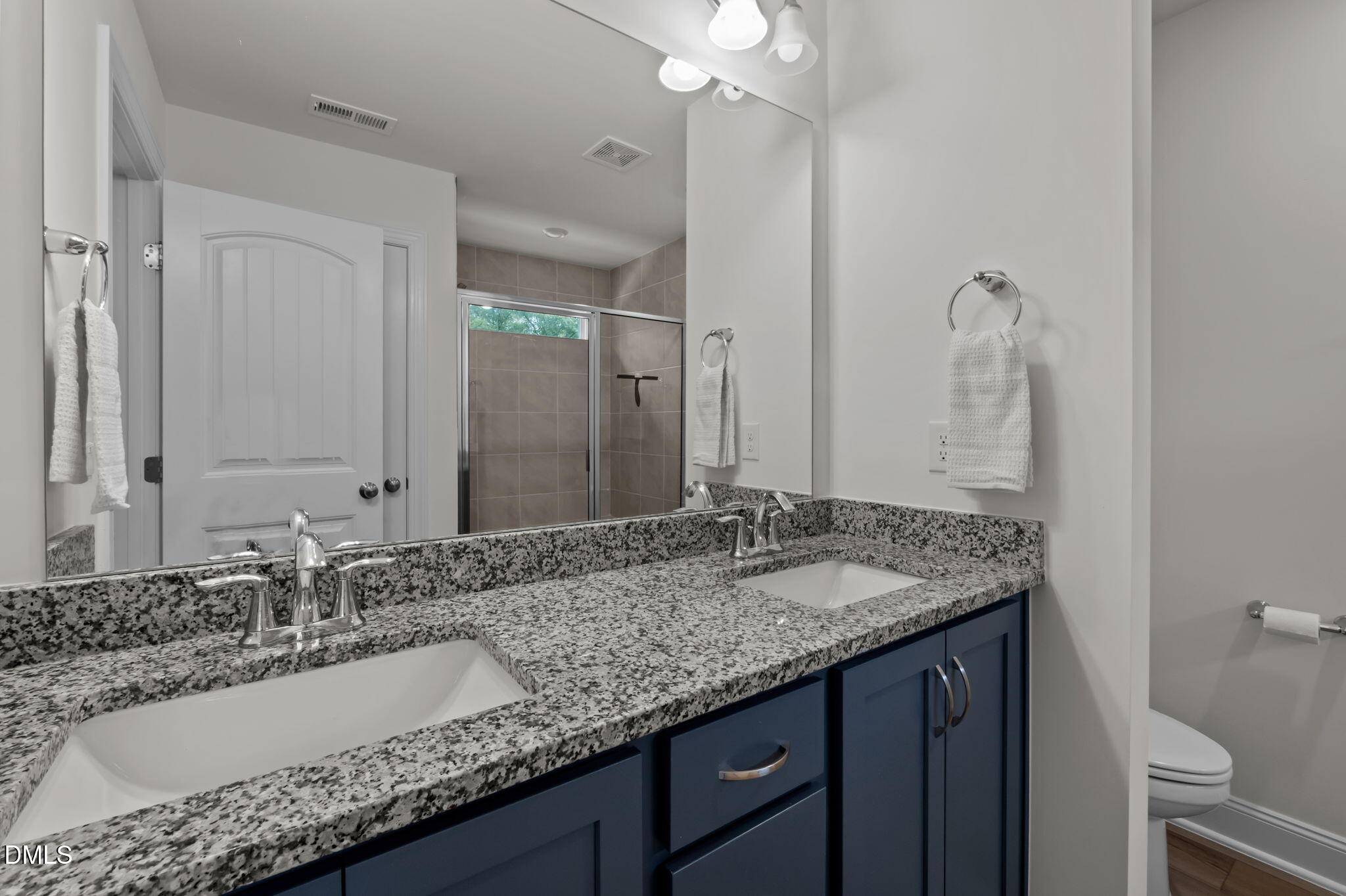 1031 Culloden Circle Durham, NC 27713 - Photo 33 of 50 a bathroom with a granite countertop sink and a mirror