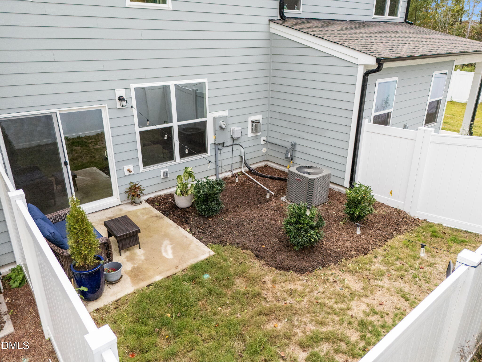 1031 Culloden Circle Durham, NC 27713 - Photo 40 of 50 a view of a backyard with chair and potted plants