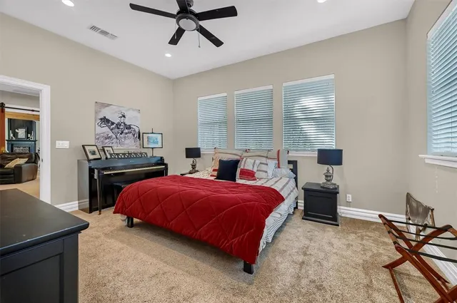 a bedroom with a bed and a table in it