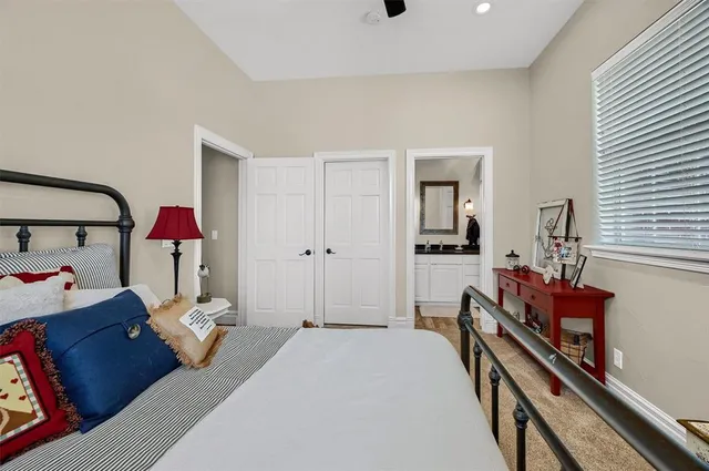 a bedroom with furniture and a window