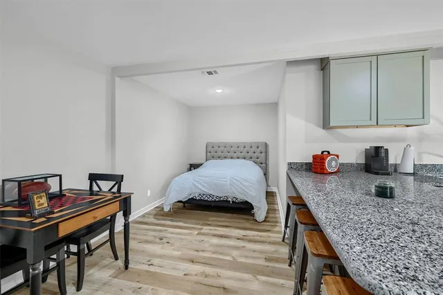 a bedroom with a bed and a table in it