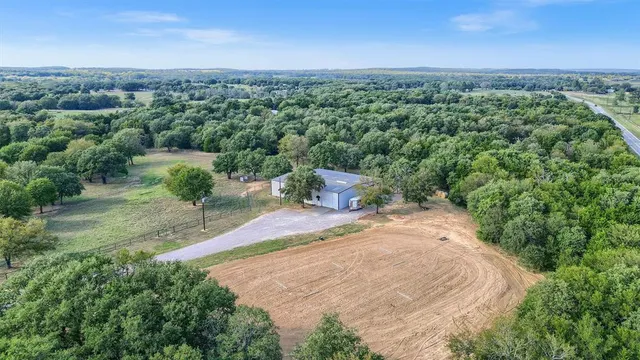 an aerial view of a house with mountain view