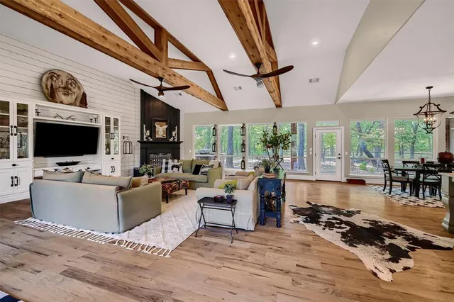 a living room with furniture flat screen tv and a fireplace