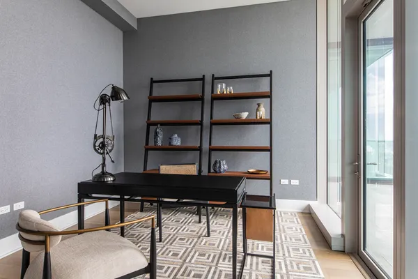 a table and a chair in a room