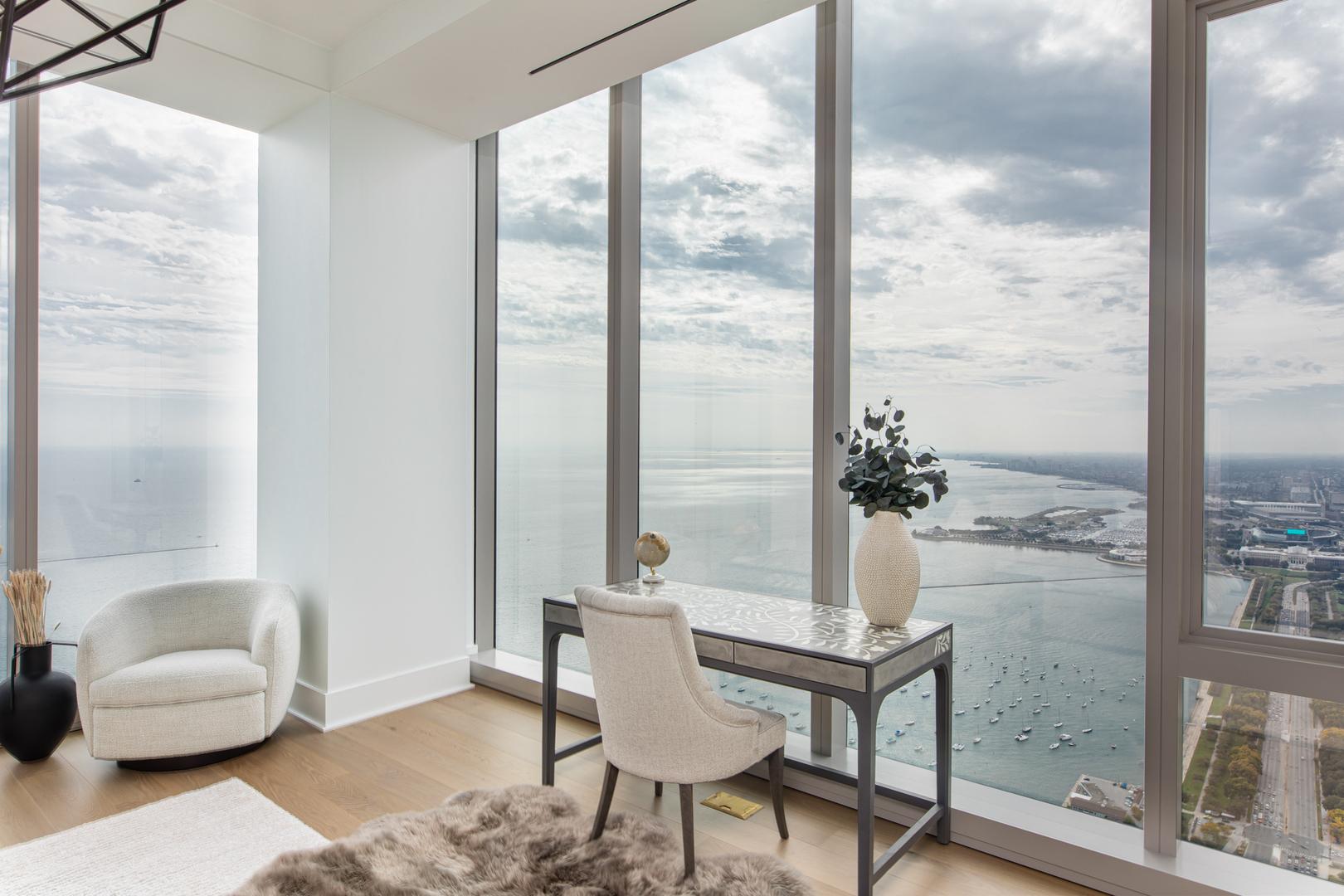 363 East Wacker Drive, Unit 8601 Chicago, IL 60601 - Photo 15 of 22 a living room with furniture and a floor to ceiling window