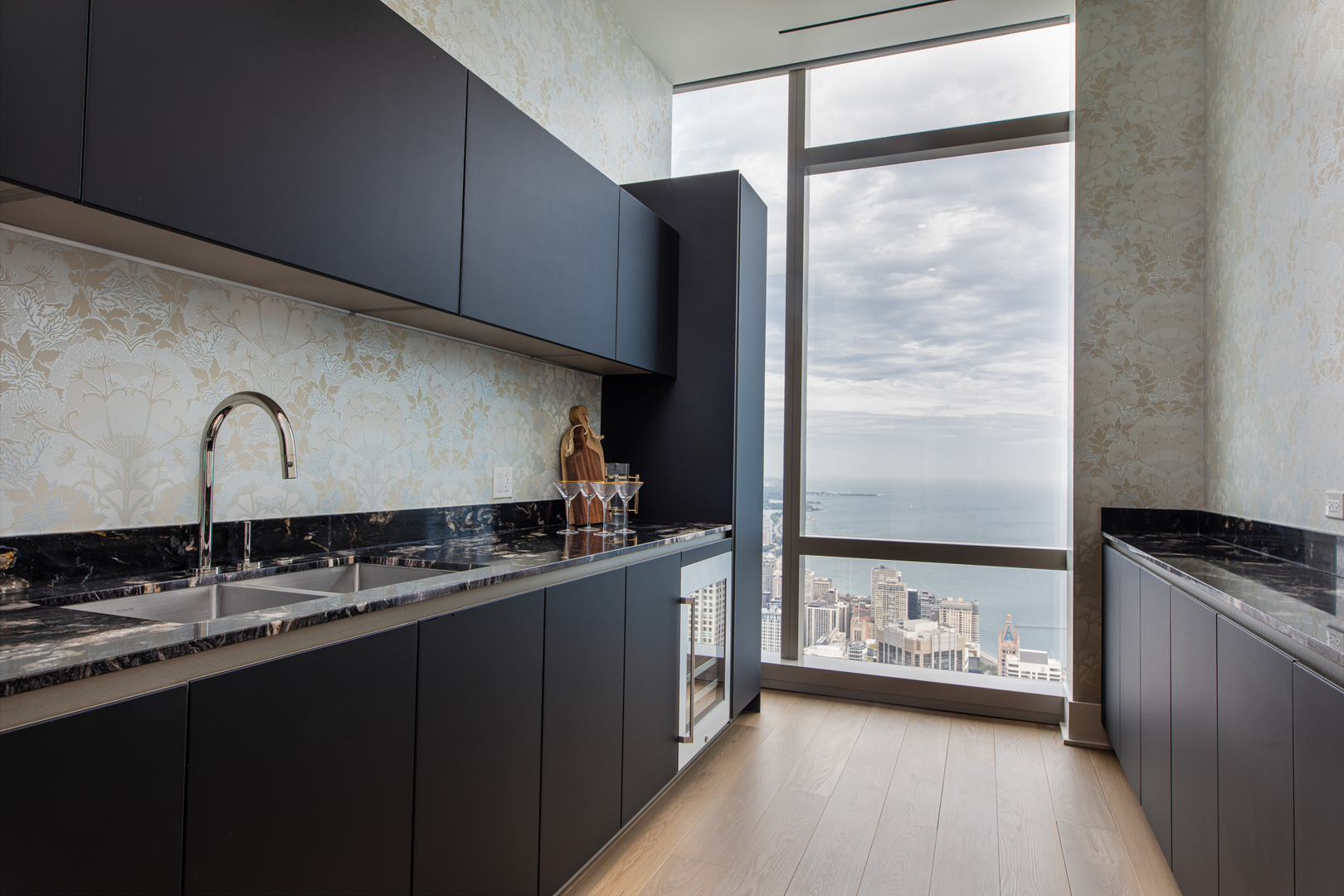 363 East Wacker Drive, Unit 8601 Chicago, IL 60601 - Photo 5 of 22 a kitchen with stainless steel appliances a sink stove and cabinets
