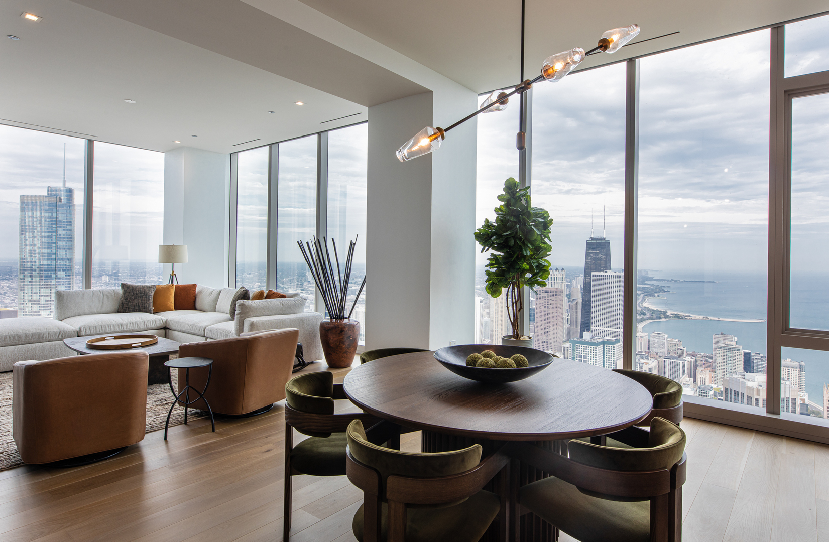 363 East Wacker Drive, Unit 8601 Chicago, IL 60601 - Photo 7 of 22 a view of a dining room with furniture window and wooden floor