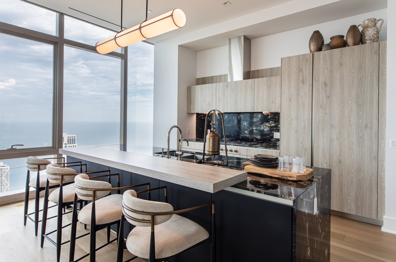 363 East Wacker Drive, Unit 8601 Chicago, IL 60601 - Photo 8 of 22 a kitchen with a table chairs and a window