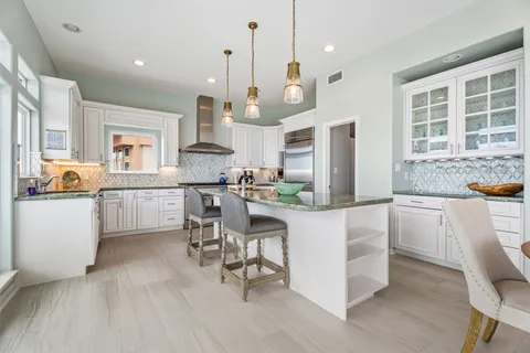 a kitchen with lots of counter space and appliances