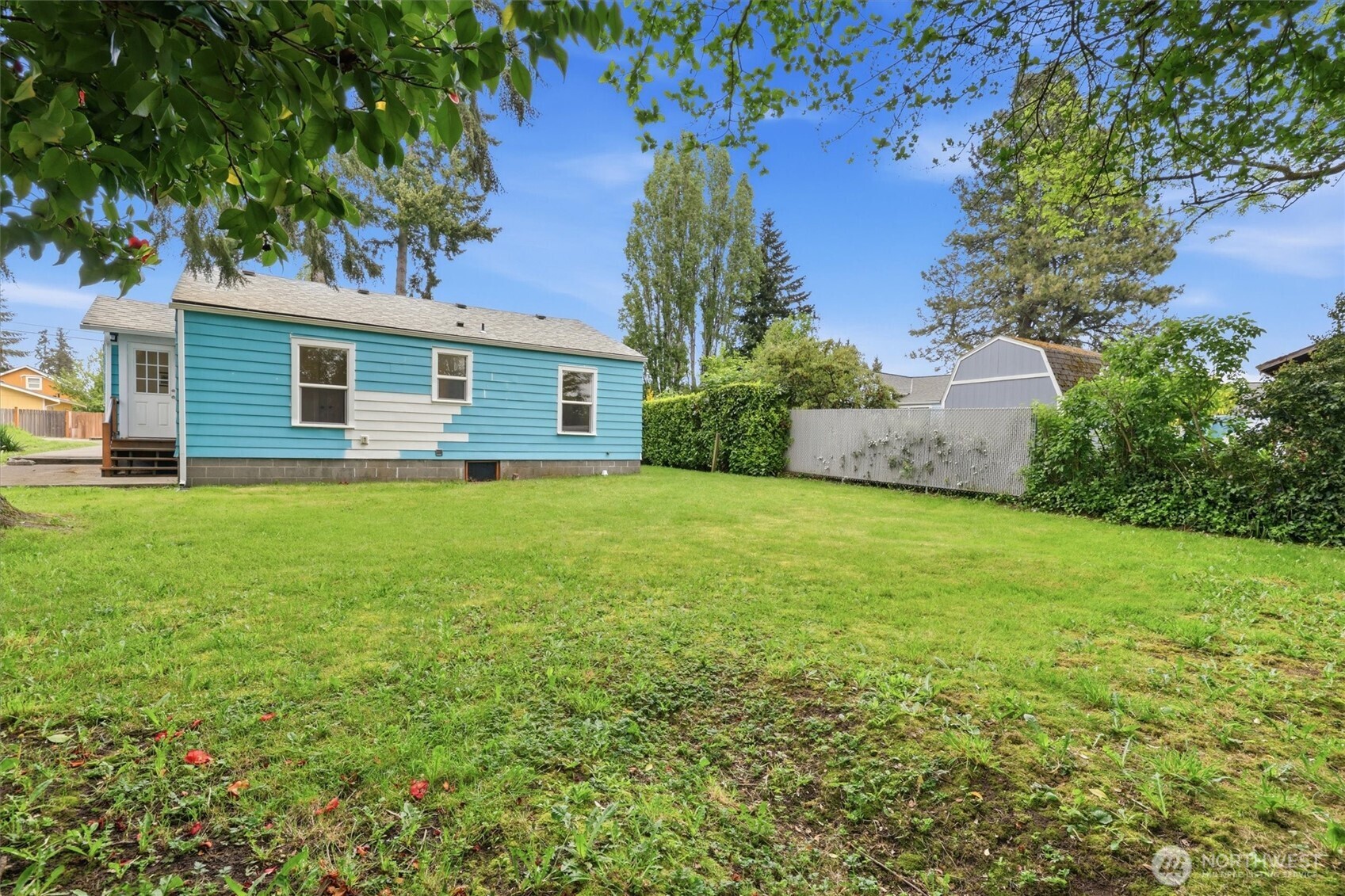 1651 Southwest 114th Street Seattle, WA 98146 - Photo 30 of 37 a view of a house with a yard
