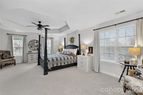 a bedroom with furniture and a window