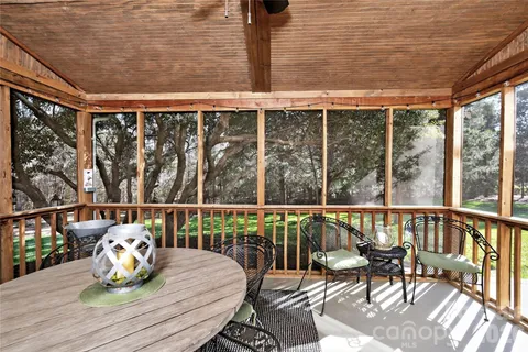 a view of a chairs and table on the deck