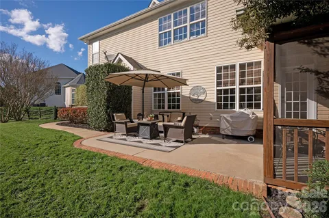 a view of the house with backyard porch and sitting area