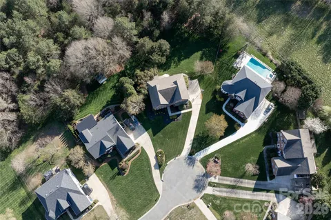 an aerial view of a house with outdoor space