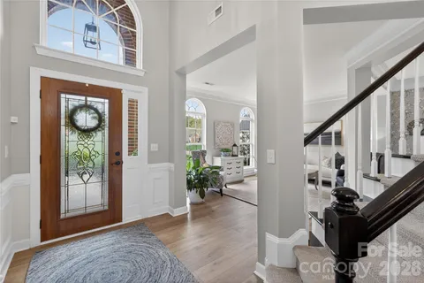 a view of an entryway with wooden floor
