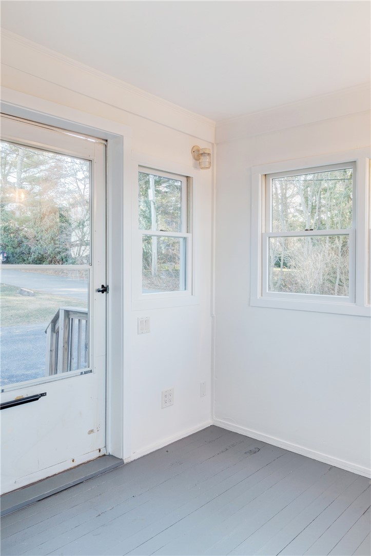 35 Corys Court Portsmouth, RI 02871 - Photo 9 of 23 Enclosed porch leads to living room