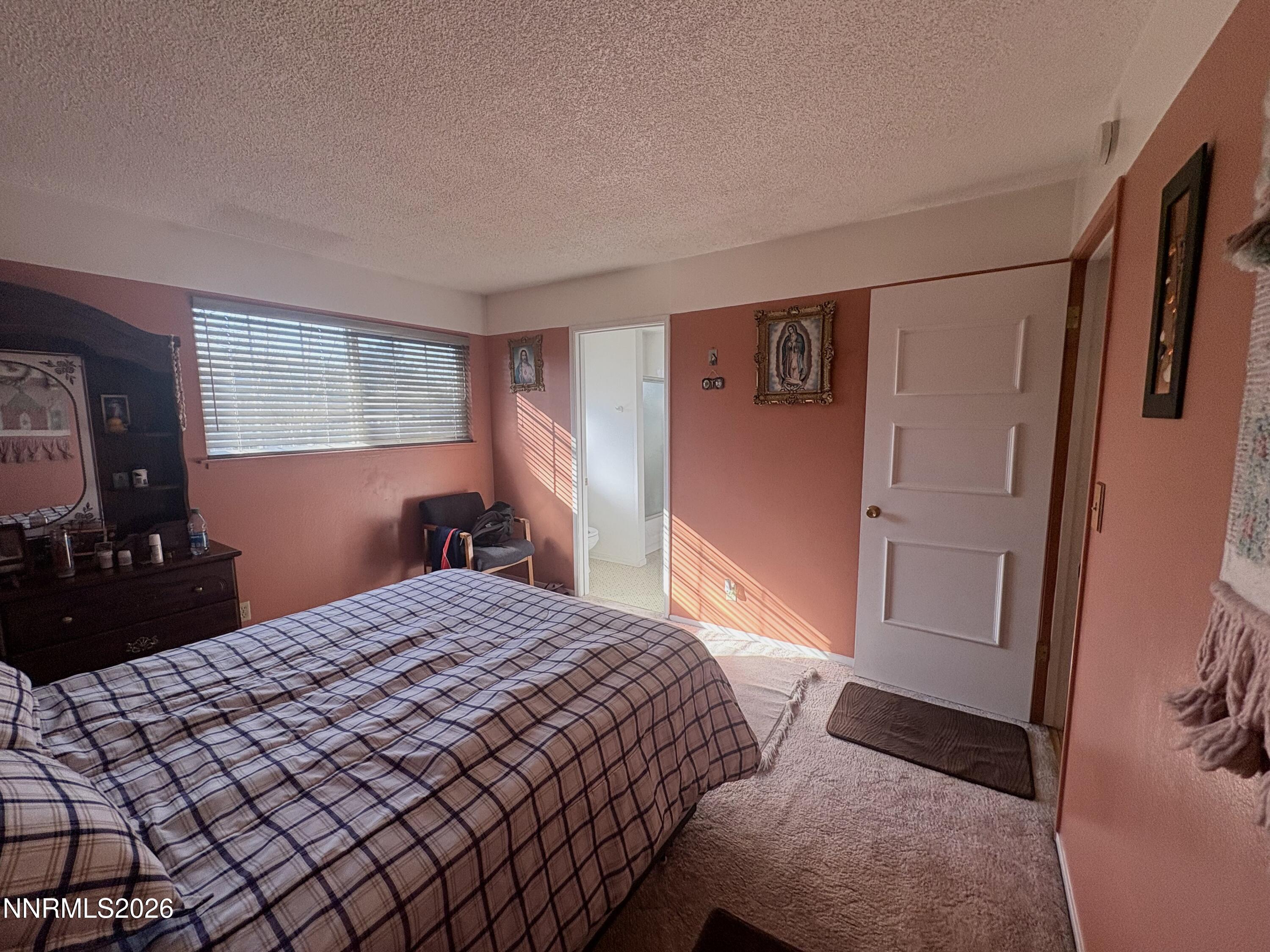 4330 Valdez Way Reno, NV 89502 - Photo 15 of 35 a bedroom with a bed and a dresser