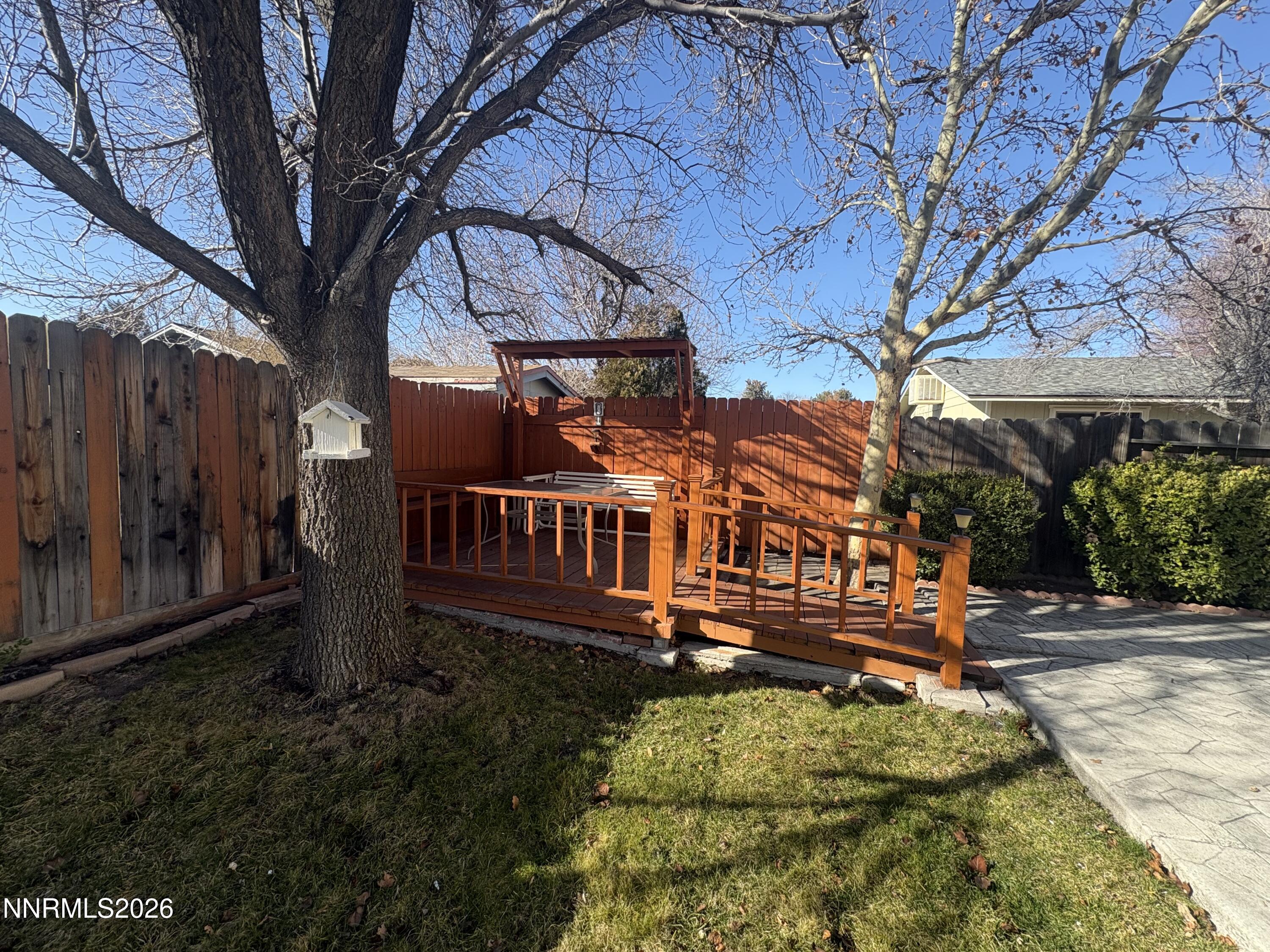 4330 Valdez Way Reno, NV 89502 - Photo 30 of 35 a view of a house with large trees and wooden fence
