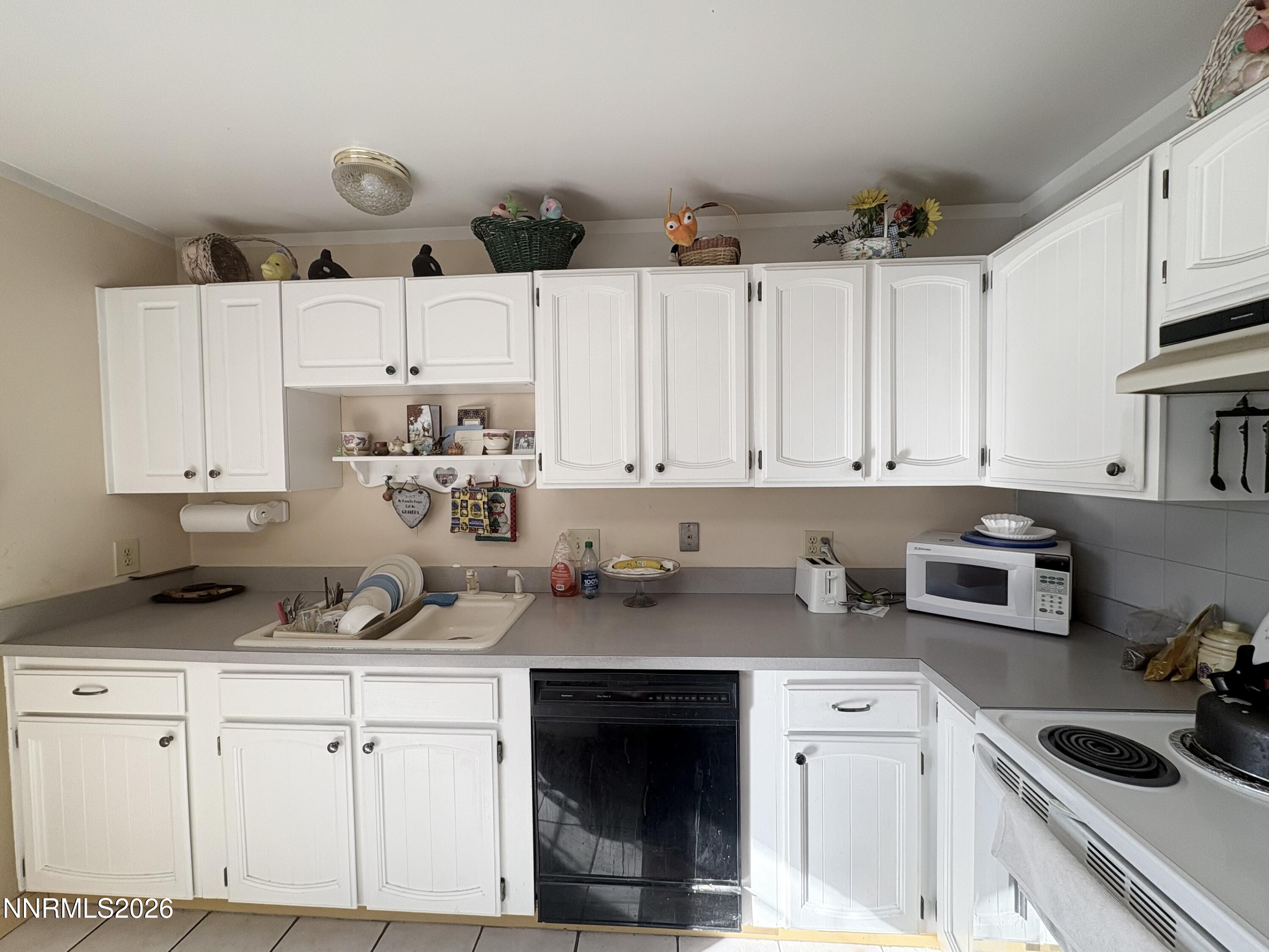 4330 Valdez Way Reno, NV 89502 - Photo 4 of 35 a kitchen with cabinets appliances a sink and a counter top space