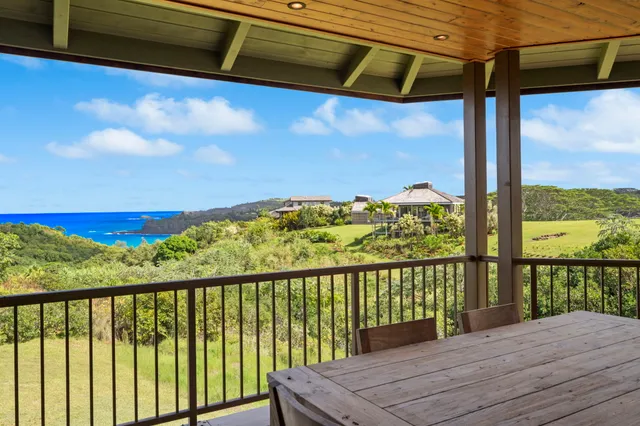a bathroom with a granite countertop shower a mirror and a sink